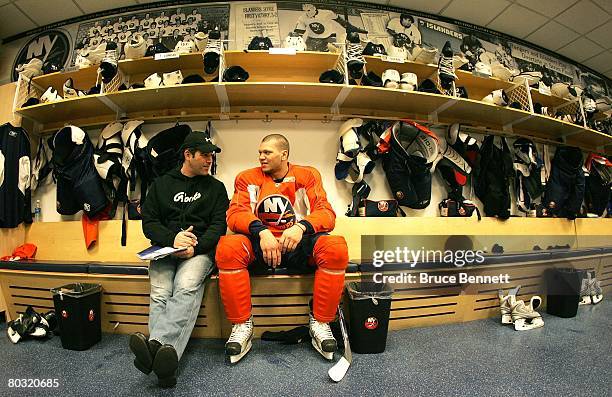 Broadcaster Billy Jaffe interviews Kyle Okposo of the New York Islanders after the morning skate on March 18, 2008 at the Nassau Coliseum in...