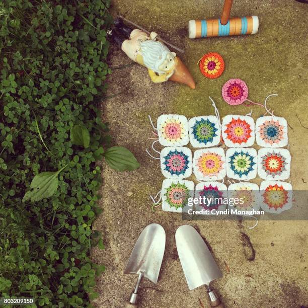 garden gnome and crochet squares - garden trowel stock pictures, royalty-free photos & images