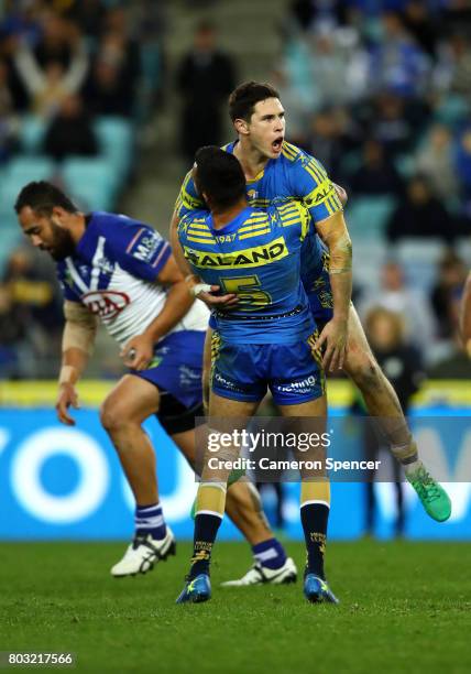 Mitchell Moses of the Eels celebrates kicking the winning field goal in extra-time during the round 17 NRL match between the Parramatta Eels and the...