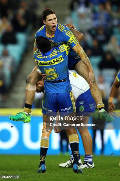 Mitchell Moses of the Eels celebrates kicking the winning field goal in extra-time during the round 17 NRL match between the Parramatta Eels and the...