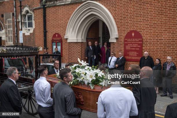 The coffin is carried into a church during the funeral of one of the victims of the fire in Grenfell Tower, on June 29, 2017 in London, England. Tony...