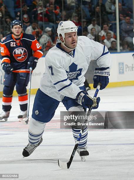 Ian White of the Toronto Maple Leafs takes the shot against the New York Islanders on March 18, 2008 at the Nassau Coliseum in Uniondale, New York.