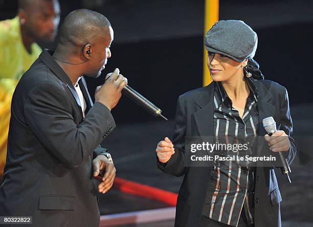 Singers Passi and Laam perform on stage during the Fight Aids Monaco Gala on March 20, 2008 in Monaco.