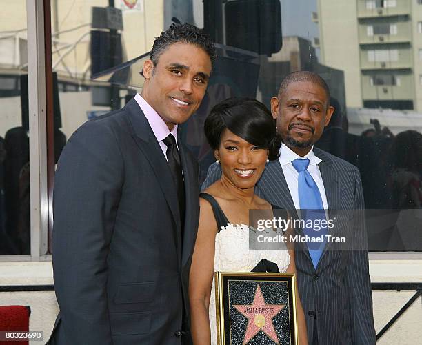 Actor Rick Fox, actress Angela Bassett and actor Forest Whitaker pose for the cameras at the Star on the Hollywood Walk of Fame honoring Angela...