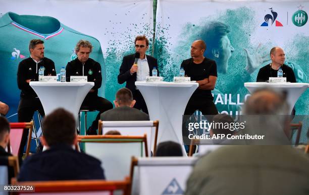 Saint-Etienne's French President Roland Romeyer is watched by Saint-Etienne's Spanish head coach Oscar Garcia and Saint-Etienne's French former...