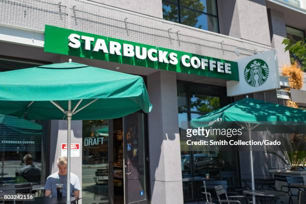 Man works outdoors at a Starbucks Coffee cafe in the San Francisco Bay Area town of Walnut Creek, California, June 22, 2017. .