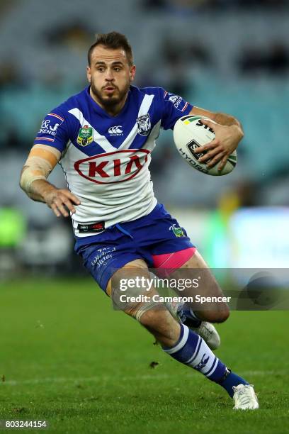 Josh Reynolds of the Bulldogs runs the ball during the round 17 NRL match between the Parramatta Eels and the Canterbury Bulldogs at ANZ Stadium on...