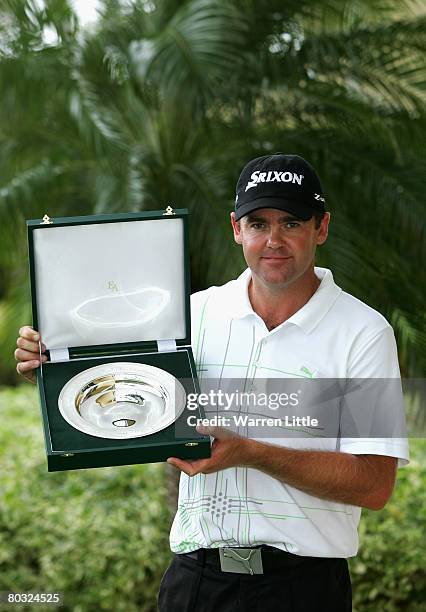 Mark Brown of New Zealand poses with his award for being The European Tour Golfer Of The Month for February during the first round of the 2008 World...