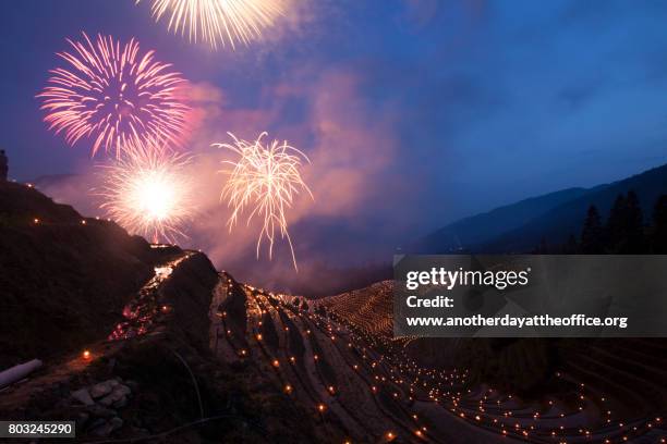 longji rice terraces firework - chinese festival stock-fotos und bilder