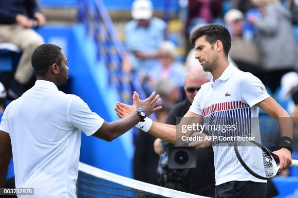 Serbian tennis player and world number four, Novak Djokovic shakes hands with Donald Young of the US after winning their men's singles quarter final...