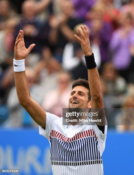 Novak Djokovic of Serbia celebrates his victory during the men's singles quarter final match against Donald Young of The United States on day five of...