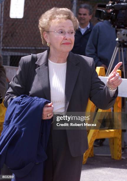 Dorothy Moxley, the mother of the slain Greenwich, CT teenager Martha Moxley, gestures towards reporters and the media outside the Stamford,...