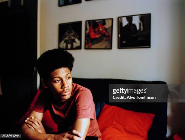 portrait of teenage boy in his bedroom - serious teenager boy ストックフォトと画像