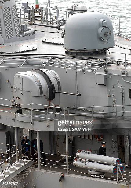 Navy soldiers stand guard while docking at a navy base in Keelung, northern Taiwan, one day before Taiwan's preisdential elections on March 21, 2008....