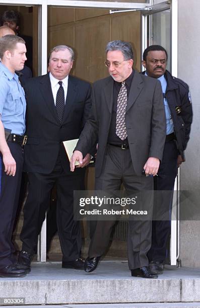 Michael Skakel, second from left, leaves the courthouse in Stamford, Connecticut early in the afternoon of April 18 where he is facing charges in the...