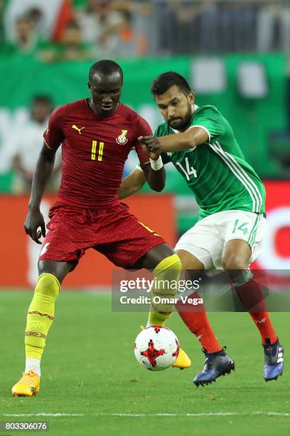 Raphael Dwamena of Ghana fights for the ball with Hedgardo Marin of Mexico during the friendly match between Mexico and Ghana at NRG Stadium on June...