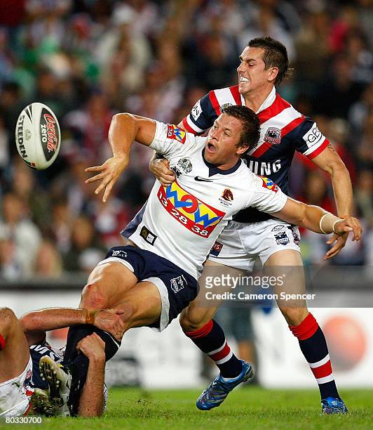 Ashton Sims of the Broncos offloads the ball in a tackle during the round two NRL match between the Sydney Roosters and the Brisbane Broncos at the...