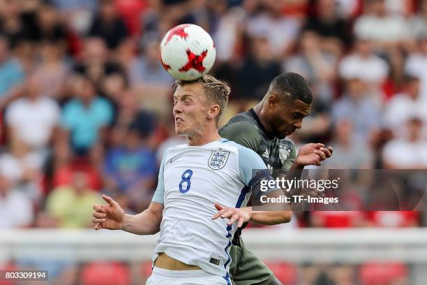 James Ward-Prowse of England and Serge Gnabry of Germany battle for the ball during the UEFA European Under-21 Championship Semi Final match between...