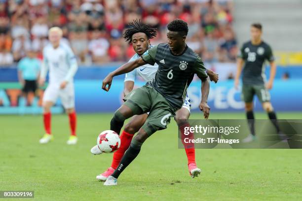 Nathaniel Chalobah of England and Gideon Jung of Germany battle for the ball during the UEFA European Under-21 Championship Semi Final match between...