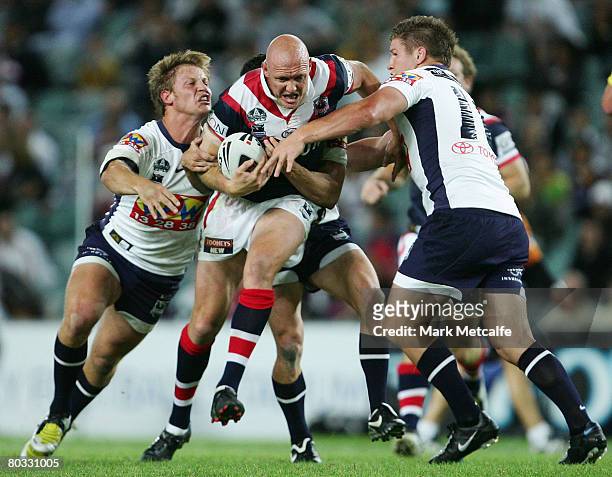 Craig Fitzgibbon of the Roosters is tackled during the round two NRL match between the Sydney Roosters and the Brisbane Broncos at the Sydney...