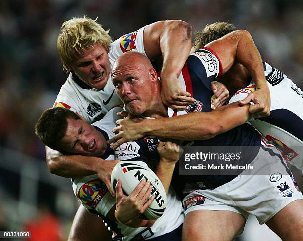 Craig Fitzgibbon of the Roosters is tackled during the round two NRL match between the Sydney Roosters and the Brisbane Broncos at the Sydney...