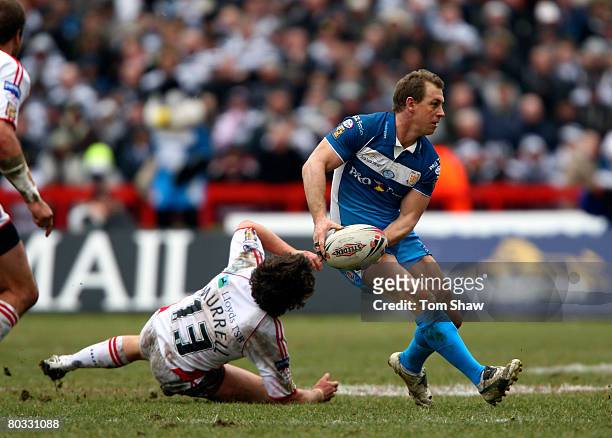 Adam Dykes of Hull FC avoids a tackle from Scott Murrell of Rovers during the Engage Super League match between Hull Kingston Rovers and Hull FC at...