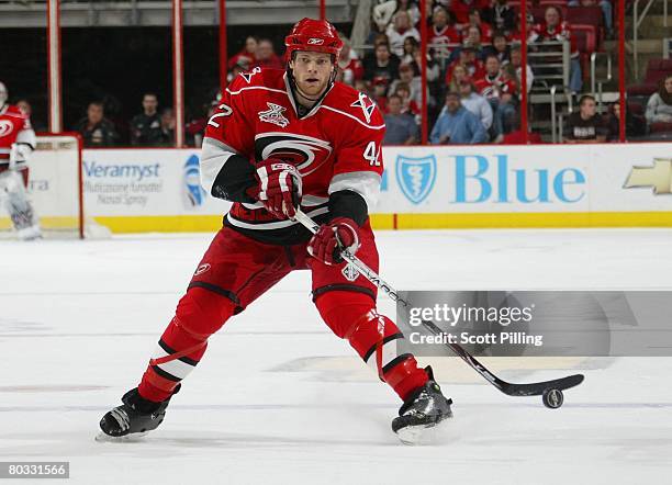 Tim Gleason of the Carolina Hurricanes skates with the puck during their NHL game against the Ottawa Senators on March 16, 2008 at RBC Center in...