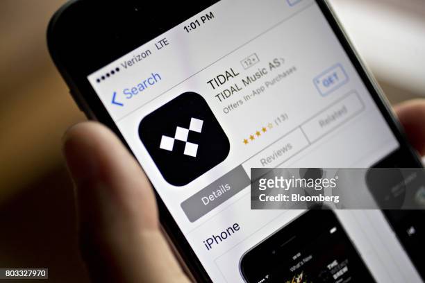 The Tidal application is seen in the App Store on an Apple Inc. IPhone in an arranged photograph in Washington, D.C., U.S., on Tuesday, June 27,...
