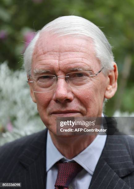 Retired Court of Appeal judge Sir Martin Moore-Bick, who will lead the Grenfell Tower fire public inquiry, speaks to the media outside St Clement's...