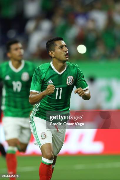 Elías Hernández of Mexico celebrates after scoring the opening goal of his team during the friendly match between Mexico and Ghana at NRG Stadium on...