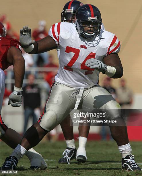 Ole Miss offensive lineman Michael Oher protects his quarterback from the Arkansas rush at Donald W. Reynolds Razorback Stadium in Fayetteville, Ark....