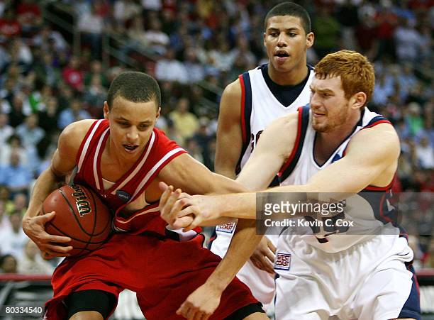 Stephen Curry of the Davidson Wildcats draws a foul from David Pendergraft of the Gonzaga Bulldogs during the 1st round of the 2008 NCAA Men's...
