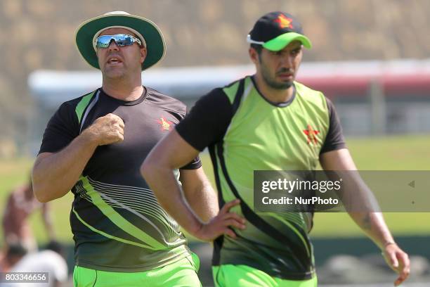 Zimbabwe cricket head coach Heath Streak and captain Graeme Creme are seen during a press conference ahead of their ODI match against Sri Lanka at...