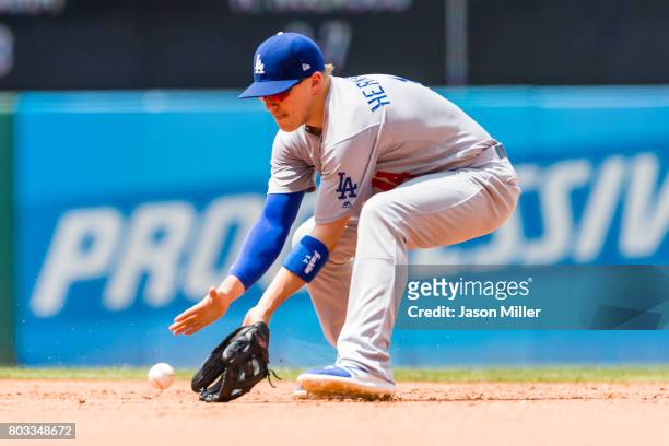 Second baseman Enrique Hernandez of the Los Angeles Dodgers fields a ground ball hit by Francisco Lindor of the Cleveland Indians during the sixth...
