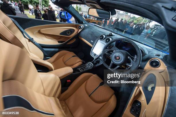 The McLaren 570S Spider automobile sits on a stand during its unveiling at the Goodwood Festival of Speed in Chichester, U.K., on Thursday, June 29,...