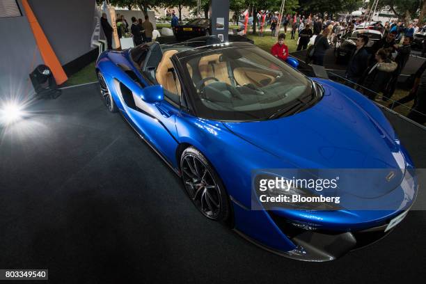 The McLaren 570S Spider automobile sits on a stand during its unveiling at the Goodwood Festival of Speed in Chichester, U.K., on Thursday, June 29,...
