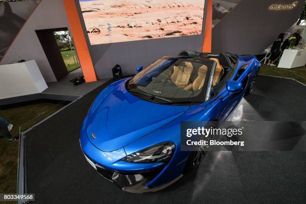 The McLaren 570S Spider automobile sits on a stand during its unveiling at the Goodwood Festival of Speed in Chichester, U.K., on Thursday, June 29,...