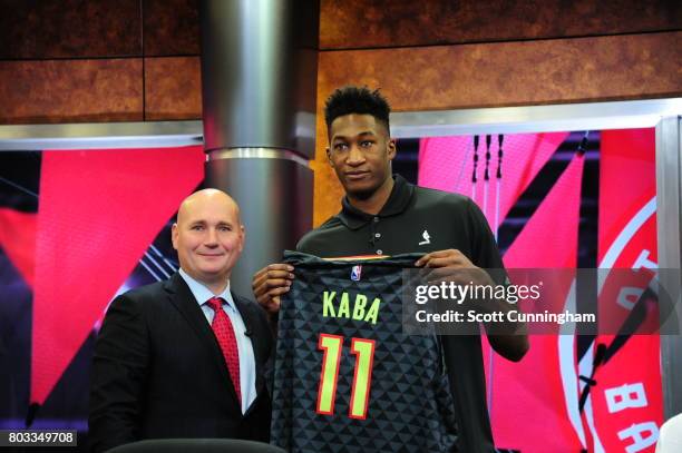 General Manager Travis Schlenk of the Atlanta Hawks introduces new draft pick Alpha Kaba during a Press Conference on June 26, 2017 at Fox Studios in...