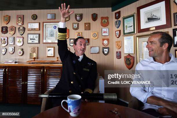 Britain's captain Christopher Wells gestures as he speaks with The Bridge 2017 organiser Damien Grimont in the command bridge of the Cunard cruise...