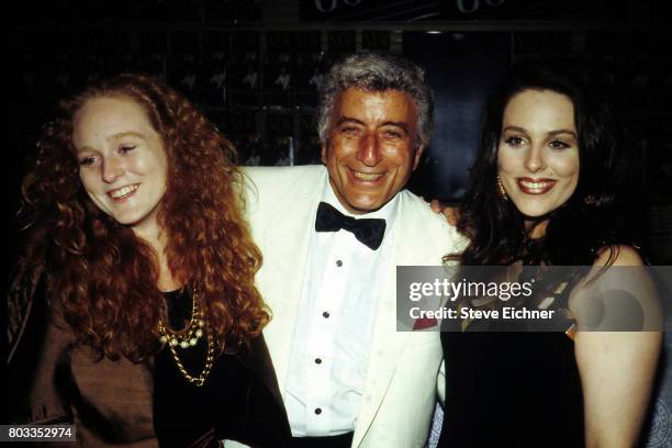 American Pop and Jazz musician Tony Bennett poses with his daughters, Antonia and Joanna, as they attend a CD release event at at a Sam Goody record...