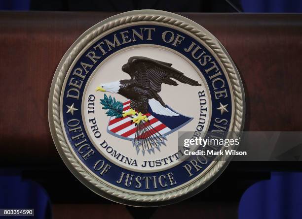 The Justice Department seal is seen on the lectern during a Hate Crimes Subcommittee summit on June 29, 2017 in Washington, DC. The meeting gave...