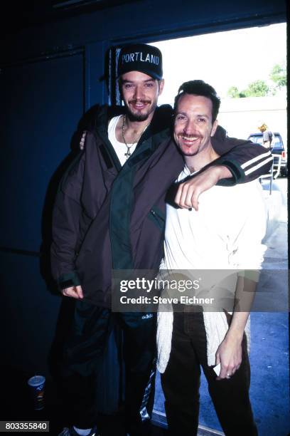 Portrait of American Rap musician Danny Boy O'Connor , of the group House of Pain, and LifeBeat executive directoy Tim Rosta as they pose together at...