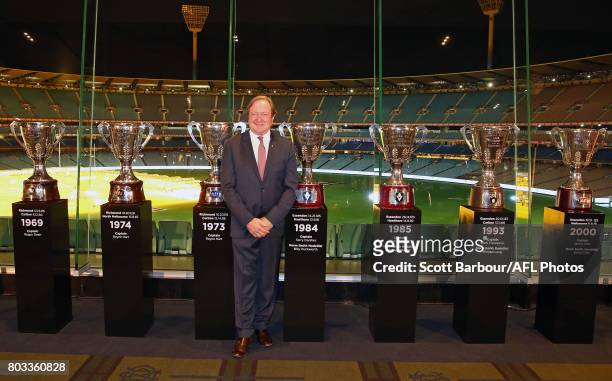 Kevin Sheedy stands next to AFL Premiership Cups he won after being a part of seven premiership teams during the '50 Years of Sheeds' Dinner on June...
