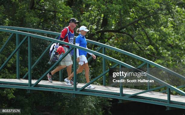 Stacy Lewis crosses a bridge with her caddie Travis Wilson on the third hole during the first round of the 2017 KPMG Women's PGA Championship at...