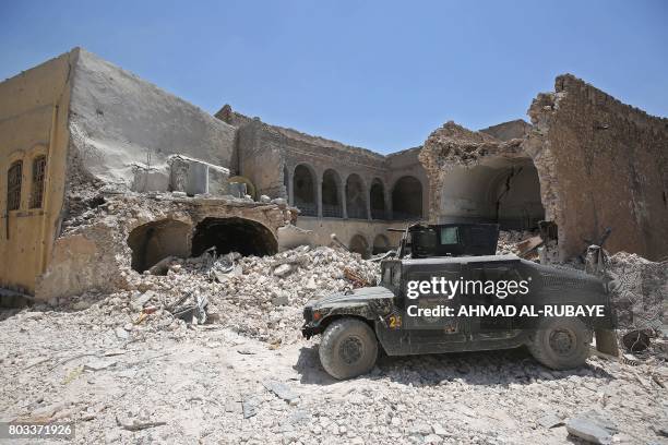 Iraqi Counter-Terrorism Service humvees advance towards the Grand Mosque of Nuri in the Old City of Mosul on June 29 during the ongoing offensive by...