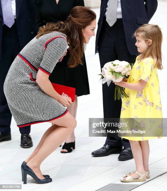 Catherine, Duchess of Cambridge receives a posy from Lydia Hunt as she visits the new V&A Exhibition Road Quarter at the Victoria & Albert Museum on...