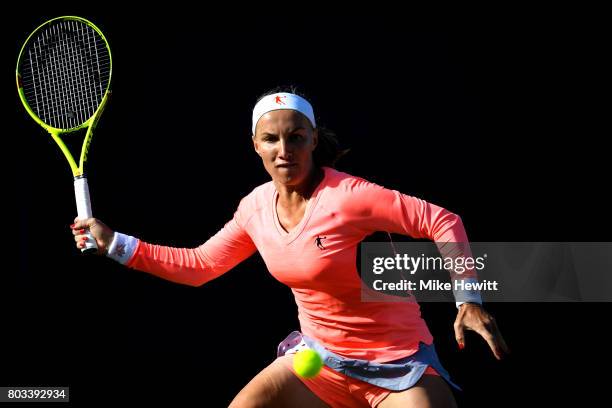 Svetlana Kuznetsova of Russia hits a forehand during the ladies singles quarter final match against Karolína Pliskova of Russia on day five of the...