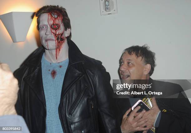 Director Sam Raimi poses with the Terminator statue at the 43rd Annual Saturn Awards - After Party held at The Castaway on June 28, 2017 in Burbank,...