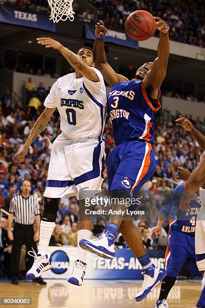 Jermaine Smith of the Texas-Arlington Mavericks goes up for a rebound against Shawn Taggart of the Memphis Tigers during the first round of the South...