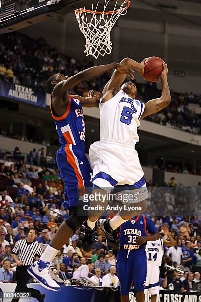 Antonio Anderson of the Memphis Tigers goes up for a shot against Trey Parker of the Texas-Arlington Mavericks during the first round of the South...